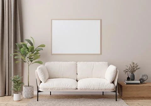 Empty horizontal picture frame on cream wall in modern living room. Mock up i Stock Photos