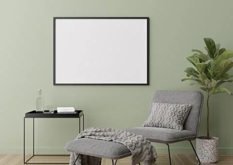 Empty horizontal picture frame on green wall in modern living room. Mock up i Stock Photos