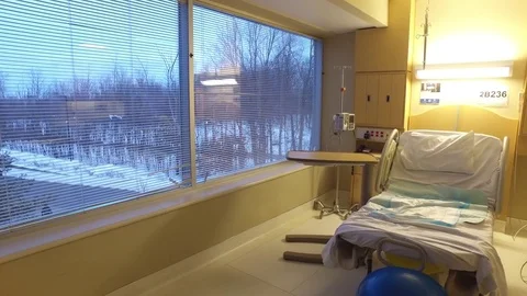 Empty hospital bed with large windows in winter Stock Footage 73158055