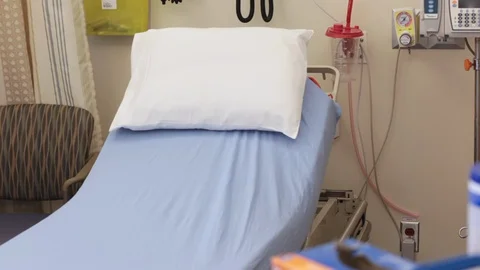 Empty hospital bed pans to bedside trays with disposable items Stock Footage 127790602