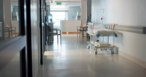 Empty hospital, corridor and bed for healthcare, wellness and medical treatment Stock Footage 252679111
