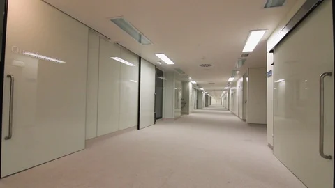 Empty hospital corridor with operating theatres at one side. Video stock 99626032