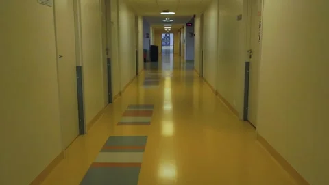 Empty hospital corridor with yellow floor Stock Footage 340140416