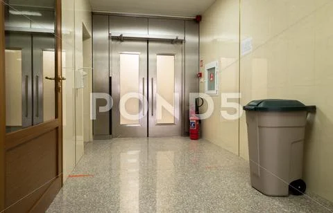 Empty Hospital Hall With Metal Door
