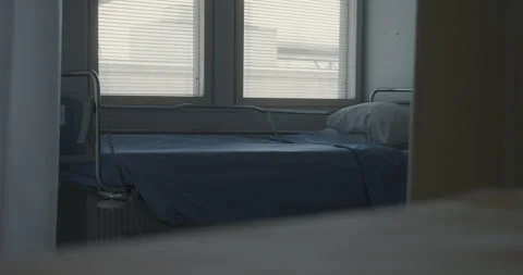 Empty hospital room bed behind the moving curtains Stock Footage 278214462