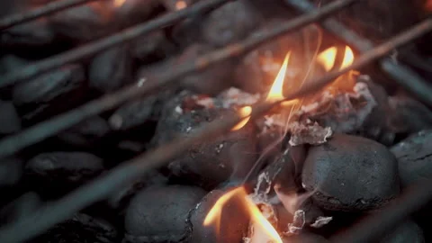 Empty hot charcoal barbecue BBQ grill with a large flame of fire and smoke Stock Footage 157370429