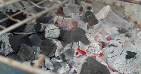 Empty hot charcoal grill with a bright flame.Burning coals. Stock Footage 281009831