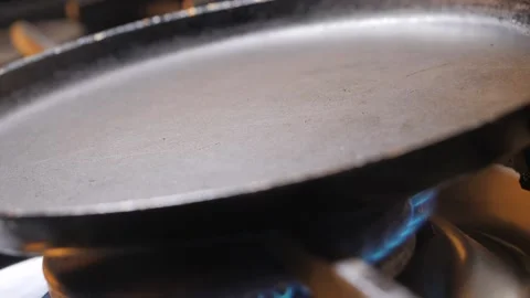 Empty hot frying pan on gas oven. Stock Footage 220716138