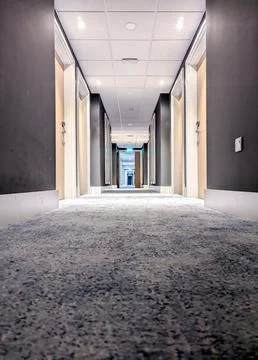 An Empty Hotel Corridor That Is Usually Found Busy With Customers Staying T.. Stock Photos