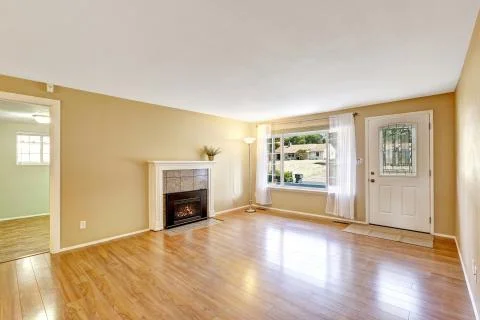 Empty house interior with cozy fireplace Stock Photos