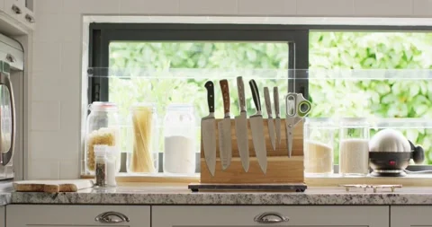 Empty house interior of kitchen with knifes in row on table Video stock 233047834