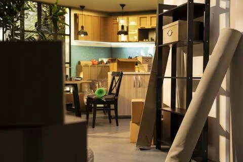 Empty house interior, packed items ready for storage, with cardboard boxes Stock Photos
