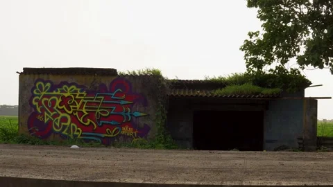 Empty House Standing Beside a Rural Road During Monsoon Stock Footage 345641519