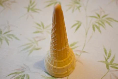 Empty ice cream cone upside down on a table Stock Photos