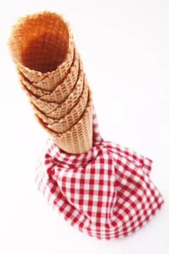 Empty ice-cream cones with checkered napkin Stock Photos