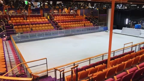 Empty ice rink aboard cruise ship and deserted bleachers waiting for spectators Stock Footage 274485328