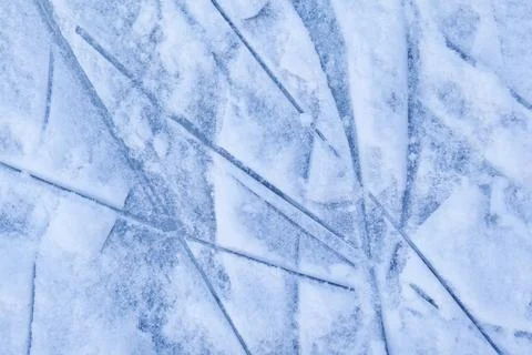 Empty ice rink with skate marks after the session outdoor. Stock Photos