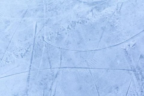 Empty ice rink with skate marks after the session outdoor. Stock Photos