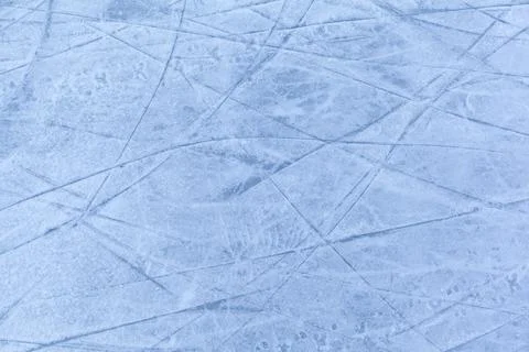 Empty ice rink with skate marks after the session outdoor. Stock Photos