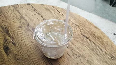 Empty Iced Coffee Takeaway Plastic Cups with Leftover Ice Cubes Stock Photos