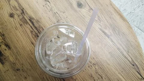 Empty Iced Coffee Takeaway Plastic Cups with Leftover Ice Cubes Stock Photos