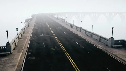 An empty illuminated asphalt road in a thick fog Video stock 235816057