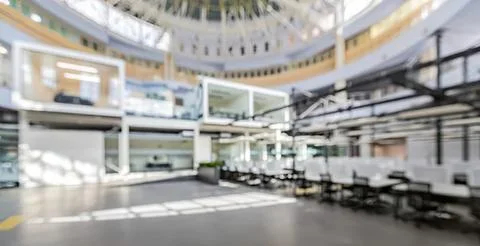 Empty indoor shopping mall with multiple levels and stores Stock Photos