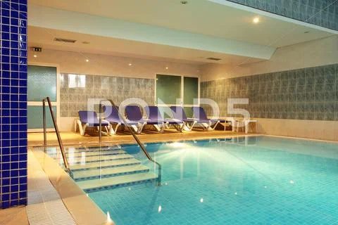 Empty indoor swimming pool Stock Photos