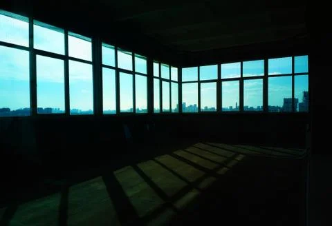 Empty industrial room with multiple windows background Stock Photos