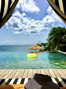 Empty infinity pool with a neon yellow float tube Stock Photos