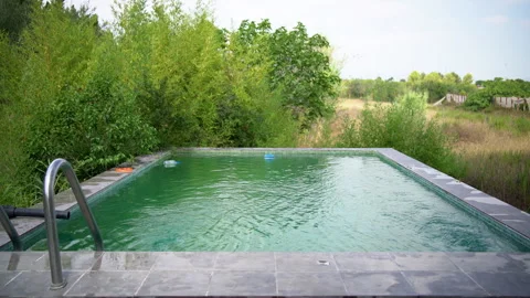 Empty Infinity Pool Surrounded by Countryside Greenery Stock Footage 343048775