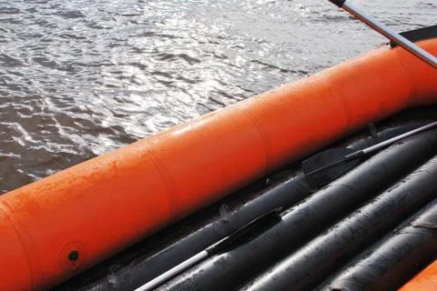 Empty inflatable raft on the water Stock Photos