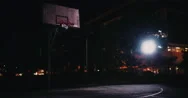 Empty Inner-City Basketball Court In The Night Stock Footage