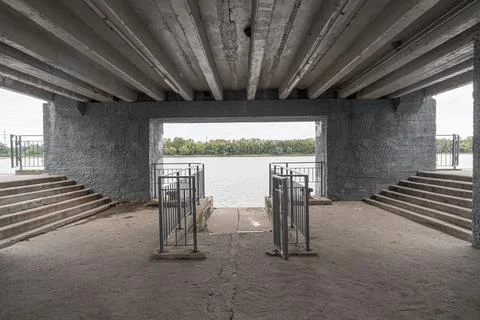 Empty interior of a modern concrete river pier. Stock Photos