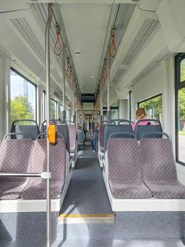 Empty interior of a modern moving public transport tram Stock Photos