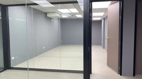 Empty interior office room clean window glass brown door white light on ceiling Stock Footage 248818101
