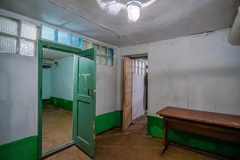 Empty interior of an old underground bomb shelter of the 1980s or basement. Stock Photos