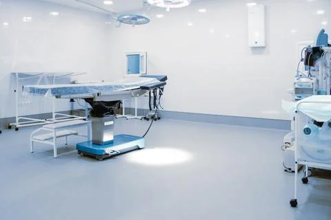 Empty interior operating room and modern equipment in hospital. Medical device Stock Photos