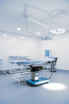 Empty interior operating room and modern equipment in hospital. Medical device Stock Photos