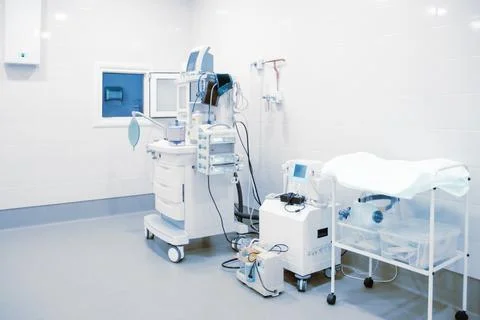 Empty interior operating room and modern equipment in hospital. Medical device Stock Photos