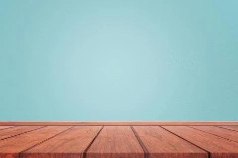 Empty interior room with light blue cement wall texture and brown wooden floo Stock Photos