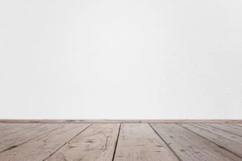 Empty interior room with white cement wall texture and brown wooden floor pat Stock Photos