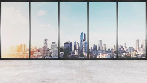 Empty interior space, concrete floor with glass wall and city view Stock Photos