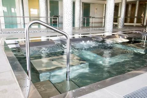 Empty interior swimming pool with relaxation area. Stock Photos
