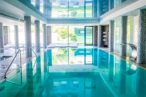 Empty interior swimming pool with relaxation area. Stock Photos