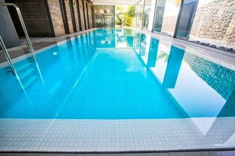 Empty interior swimming pool with relaxation area. Stock Photos