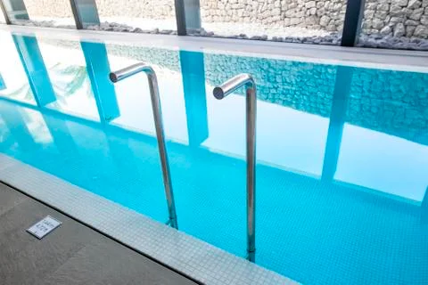 Empty interior swimming pool with relaxation area. Stock Photos