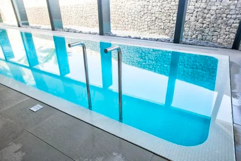 Empty interior swimming pool with relaxation area. Stock Photos