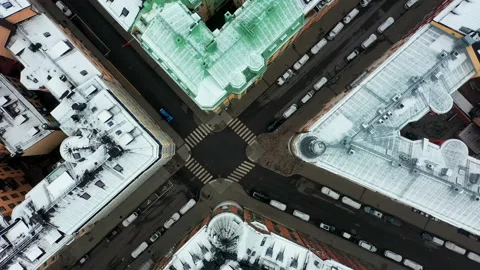 Empty intersection and snow covered building during coronavirus covid19 pandemic Stock Footage 153261679