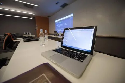 Empty it classroom empty it classroom with program code on projector scree... Photos